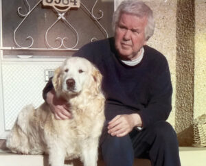 Picture of Ron Linnes with his dog. 
